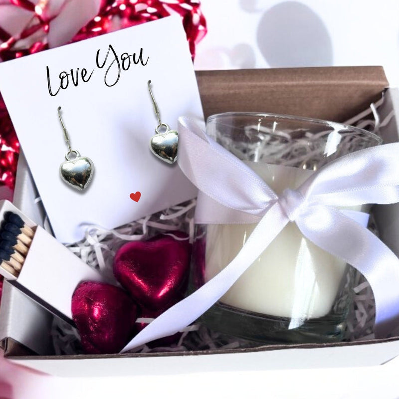 Gift set with  heart shaped earrings, candle with bow, heart shaped chocolates, 